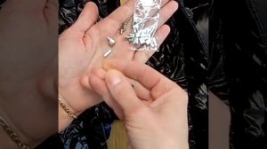 Замена нижних ограничителей на разъёмной молнии на пуховике.