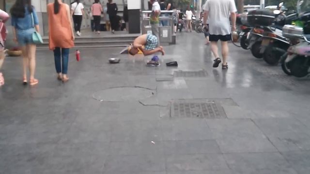 Amputee beggar sit on a bottle on road смотреть онлайн
