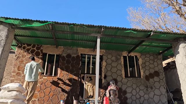 A Rural Family In Iran, A Young Couple Has Started Painting Their New House