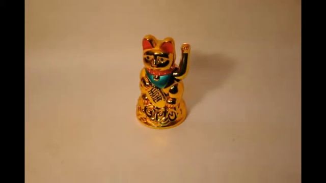 манеки неко машет лапой смотреть онлайн