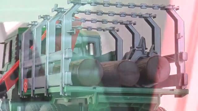Лесовоз MAN с портативным краном и брёвнами, 02-769 02769 Bruder Спецтехника игрушка смотреть онлайн