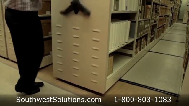 Library Shelving on Wheels Rolls on Tracks Turning Aisles into Storage Space смотреть онлайн