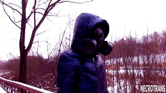 The Modern Russian MP-3 Mask Of The PMK-5 / GP-21 Gas Mask And A Dark Blue Shiny Ski Overalls.