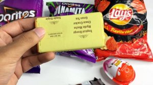 Lots of tasty kinder joy, amul chocolates, doritos, kurkure, lays, chips, spicy snacks and gems