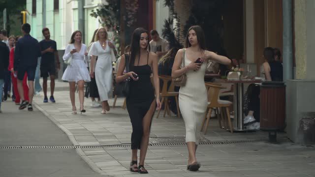 Beautiful Stylish Girls And Young People Are Relaxing In The Famous Place.