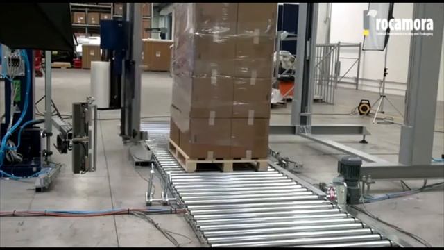 Автоматическая упаковка паллет. Паллетообмотчик Robopac с вращающейся рукой. смотреть онлайн