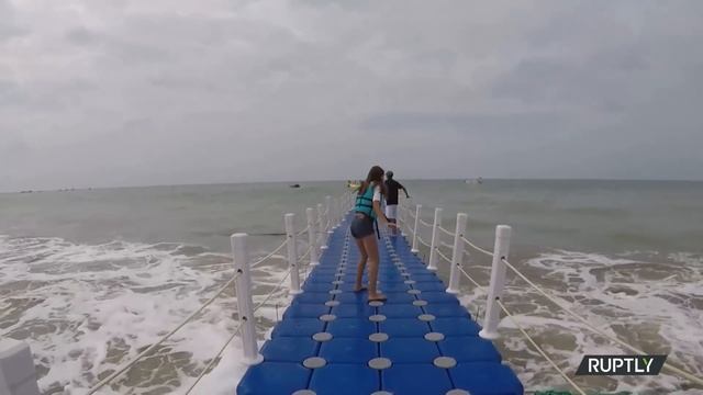 Surf the waves on this floating bridge смотреть онлайн