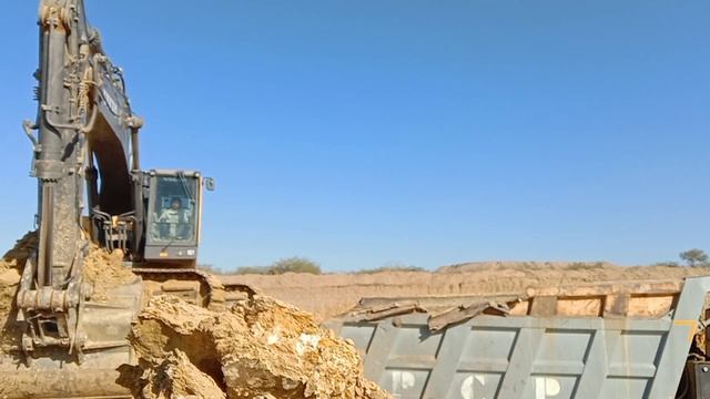 Volvo EC480DL Excavator Loading Trucks