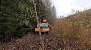 По бездорожью за дровами на минитракторе.