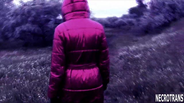 A progressive creature in black leather leggings, red shiny down jacket with hood and a gas mask смотреть онлайн
