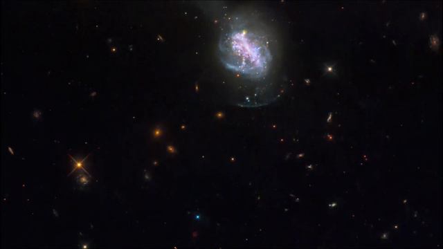 NASA Hubble Space Telescope shows Merged Galaxy ESO 185-IG013, luminous blue compact galaxy. смотреть онлайн