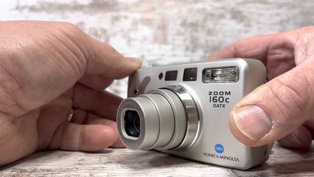 Demonstrating a Konica Minolta Zoom 160C 35mm Camera