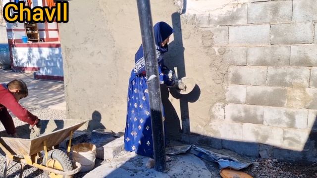 Cementing The Wall Of The House By A Poor Nomadic Woman