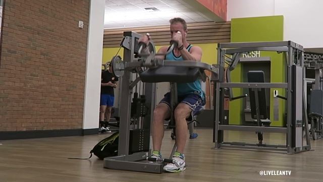 How To Do A SEATED MACHINE TRICEPS EXTENSION | Exercise Demonstration Video And Guide