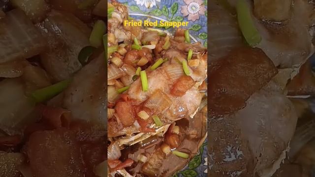 FRIED HEAD RED SNAPPER |W/ SAUTE TOMATOES ONION GARLIC GINGER AND SOY SAUCE And SPRING ONION ON TOP