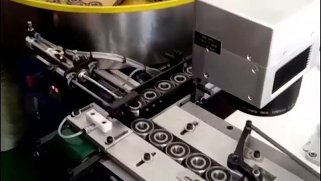 Конвейер для лазерной маркировки подшипников с накопителем автоподатчиком 35000 шт/смена смотреть онлайн