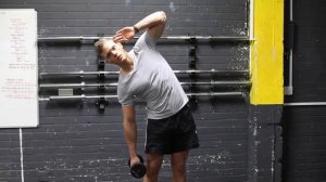 Наклоны в стороны с гантелями