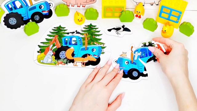 По полям Синий трактор едет к нам у него в принципе кто-то песенку поёт сибираем пазл для детей