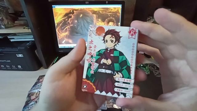 Открытие пака с карточками по аниме Клинок Рассекающий Демонов смотреть онлайн