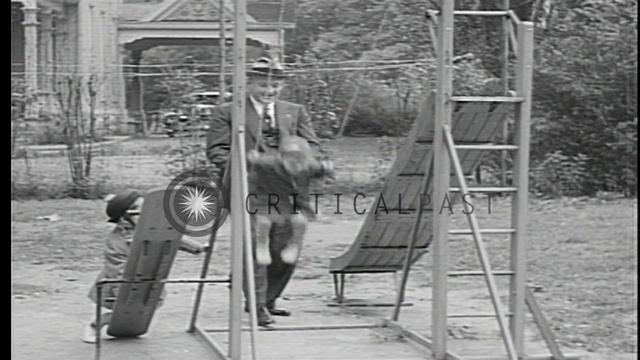 Governor of Kansas Alfred "Alf" Mossman Landon walks in the garden and plays with...HD Stock Footag смотреть онлайн