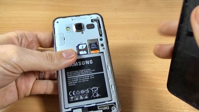 Samsung Galaxy J5 Duos - How to Insert SIM Card and micro SD Card смотреть онлайн