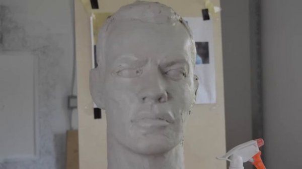 Sculpting a head in clay