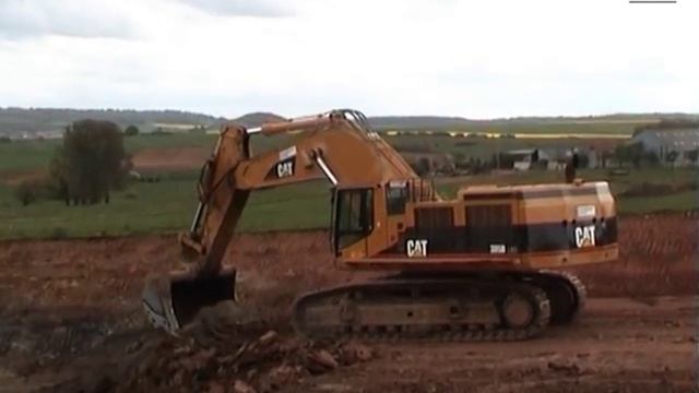 LGV Est Lot 34a: CAT 385B LME & Volvo A40D, Pont-à-Mousson - Tragny, France, 05.05.2004.