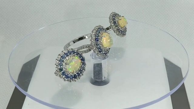 Серьги и кольцо с натуральным эфиопским опалом 8х6 мм, голубым сапфиром и белым топазом Серебро 925 смотреть онлайн