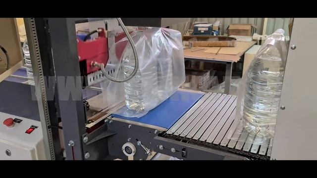 Новинка. Групповая термоупаковка ПЭТ 5 литров. Термоупаковочная машина ТМ-1АП. ДЭНКАР. смотреть онлайн