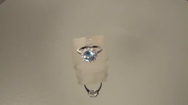 кольцо с голубым топазом и цирконами (serebrim Ru)