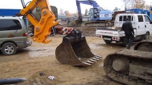 Работа каплера, смена гидромолота на ковш.