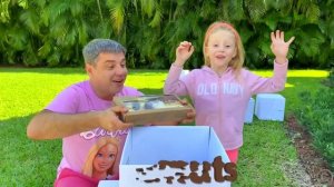 Nastya and Dad open boxes with surprises to learn the alphabet