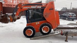 Загрузка минипогрузчика 2,5 т в прицеп.