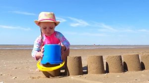 Gaby and Alex playing on the Beach with Sand and other Kids Toys