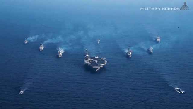 The aircraft carrier USS Gerald Ford arrived in the waters carrying dozens of F-18 fighter jets смотреть онлайн
