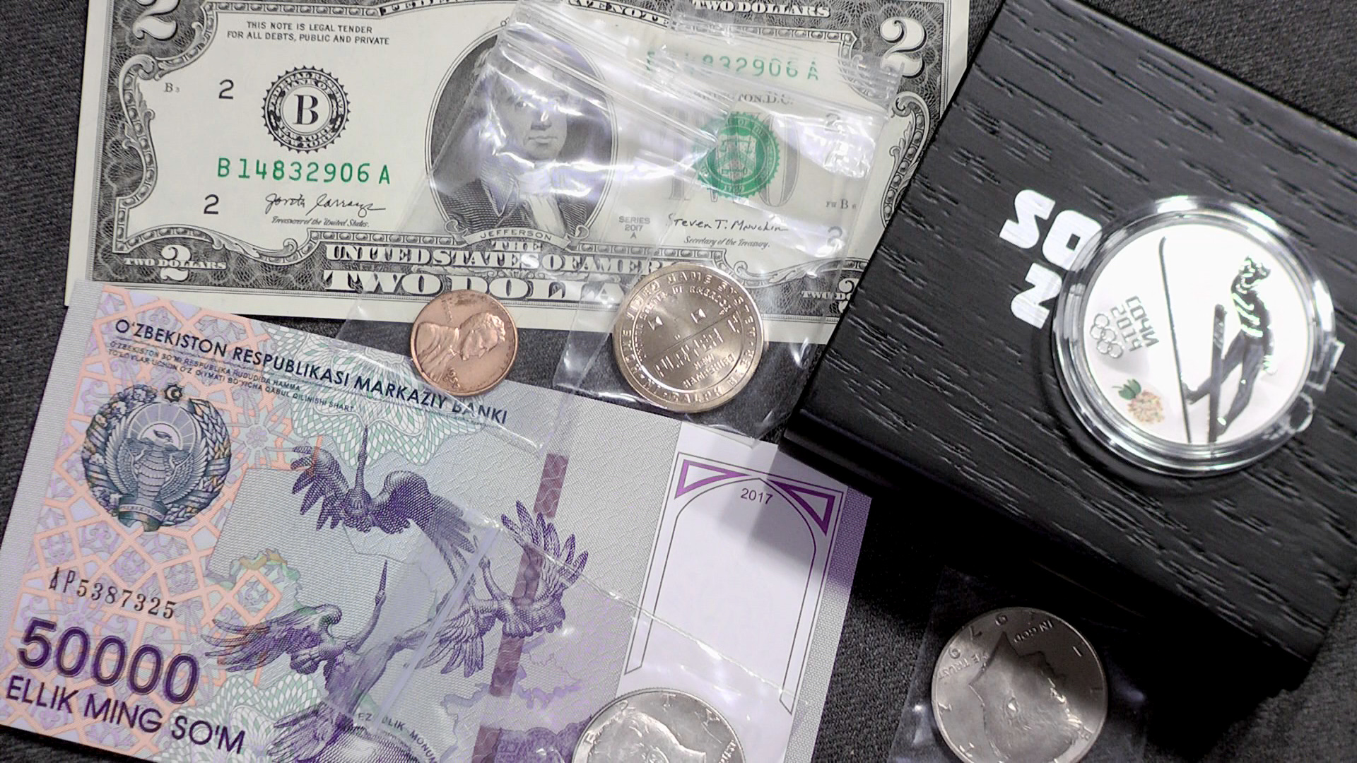 Распаковка посылки с монетами и банкнотами. Серебро Сочи, ходячка США. смотреть онлайн