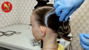 Причёска для бальных танцев с низким пучком и холодной волной.