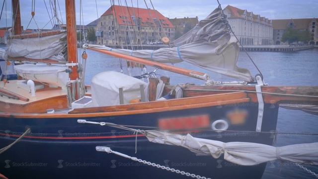 Colorful sailing yacht in Copenhagen Harbor смотреть онлайн
