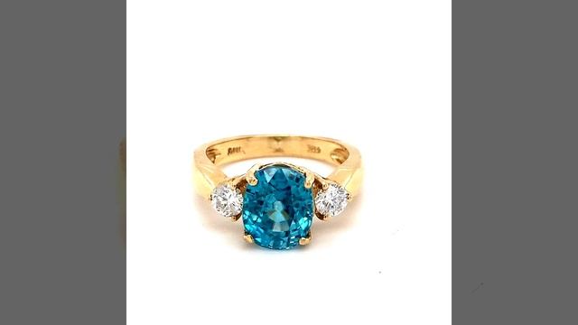 Scintillating Cushion Shaped Blue Zircon and Diamond Ring Set in 14 Karat Yellow Gold смотреть онлайн