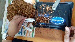 Машинка для набивки табака в гильзы.