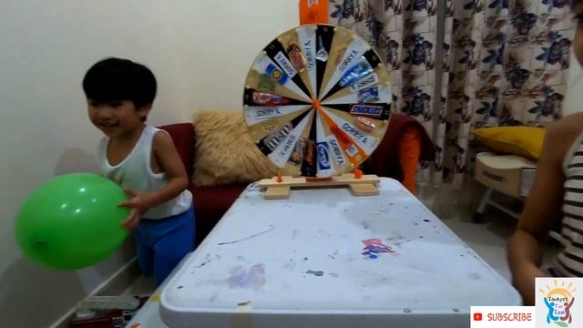 SPIN THE WHEEL GAME | Variety of Chocolates on the table смотреть онлайн