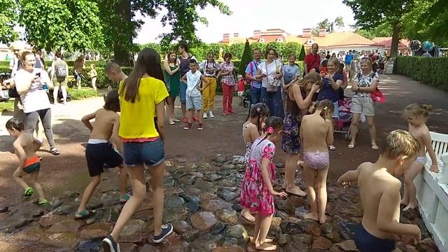 Peterhof. Saint-Petersburg. Children Tricking Fountains Playing.