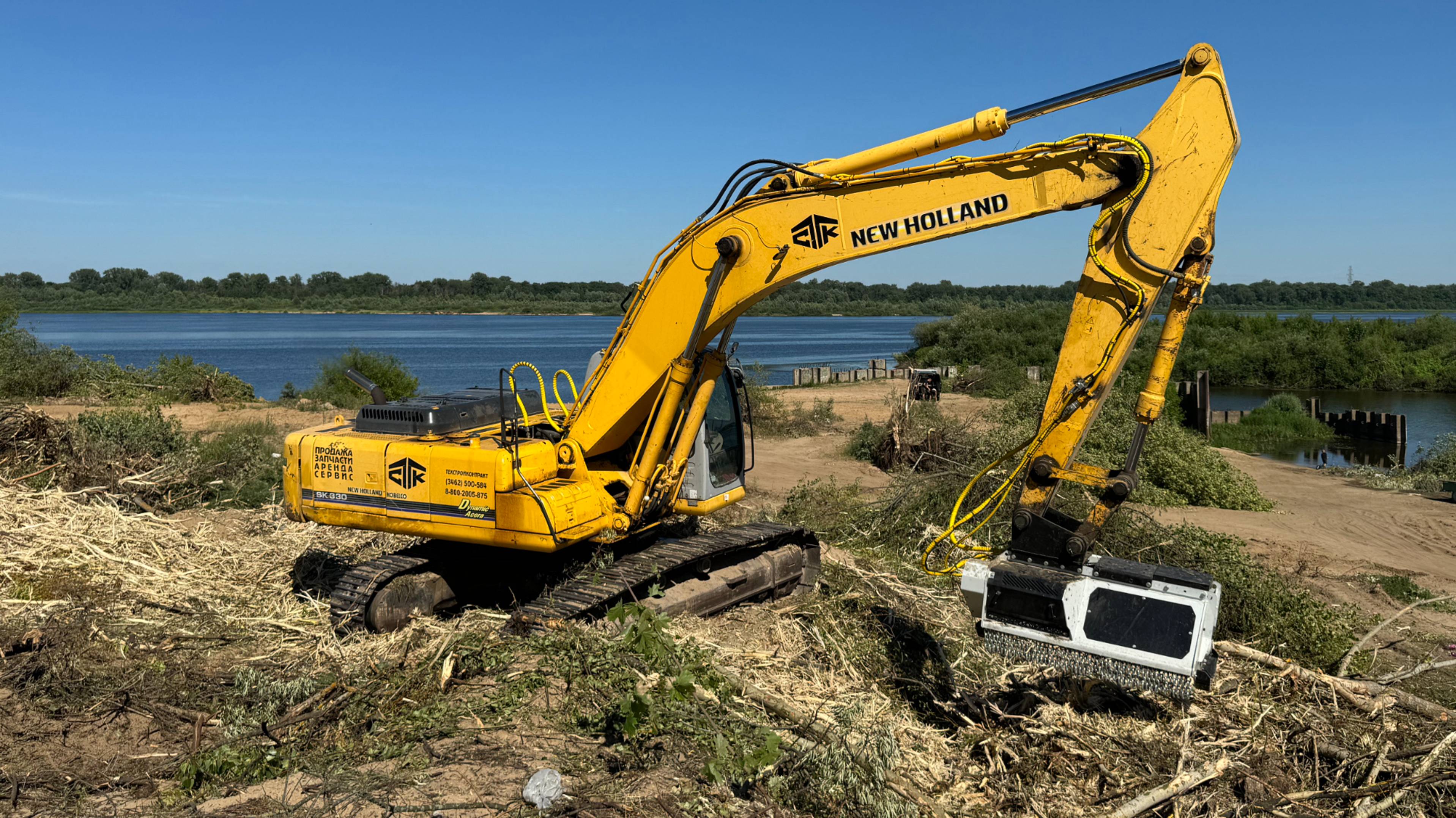 Экскаватор New Holland с гидравлическим мульчером NIUBO смотреть онлайн