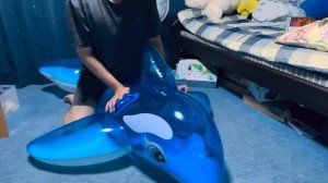Inflatable intex blue whale popping