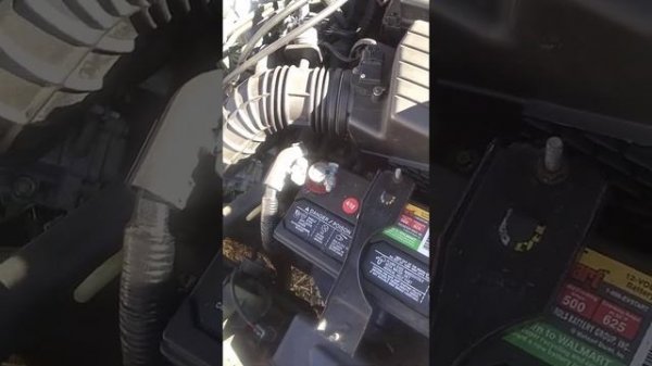 Honda Accord 2004 engine compartment with 2.4 liter 4 cylinder engine.