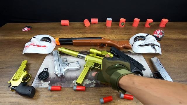 Toy Guns Vs Shotgun. Weapons Desert Eagle And Toy Hacker Masks. Shotgun - Gold Tec9